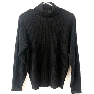 Black acrylic cable knit turtle neck.